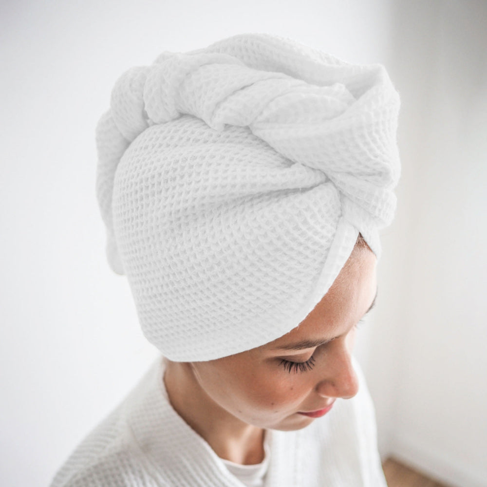 White cotton hair wrap towel worn after shower