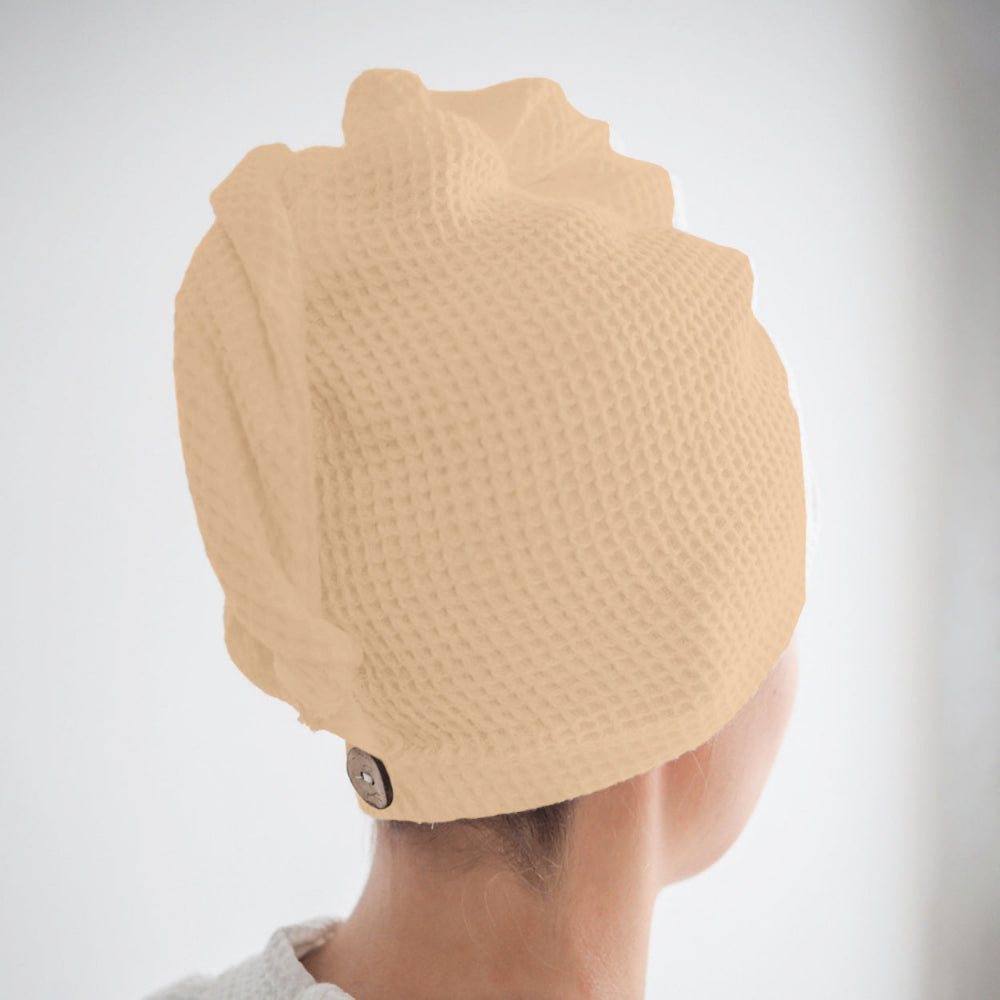 Beige waffle hair wrap towel fabric close-up