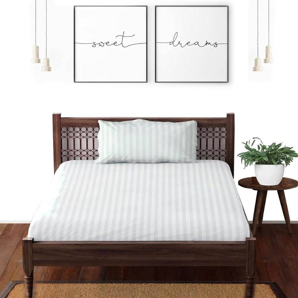 Satin striped pure cotton bedsheet in white on a double bed