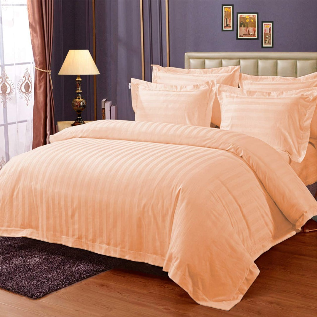 Pure cotton satin stripe king size bedsheet in light orange on bed