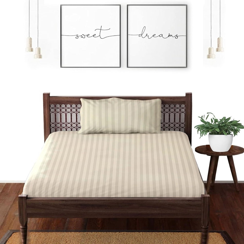 Satin striped pure cotton bedsheet in cream on a double bed