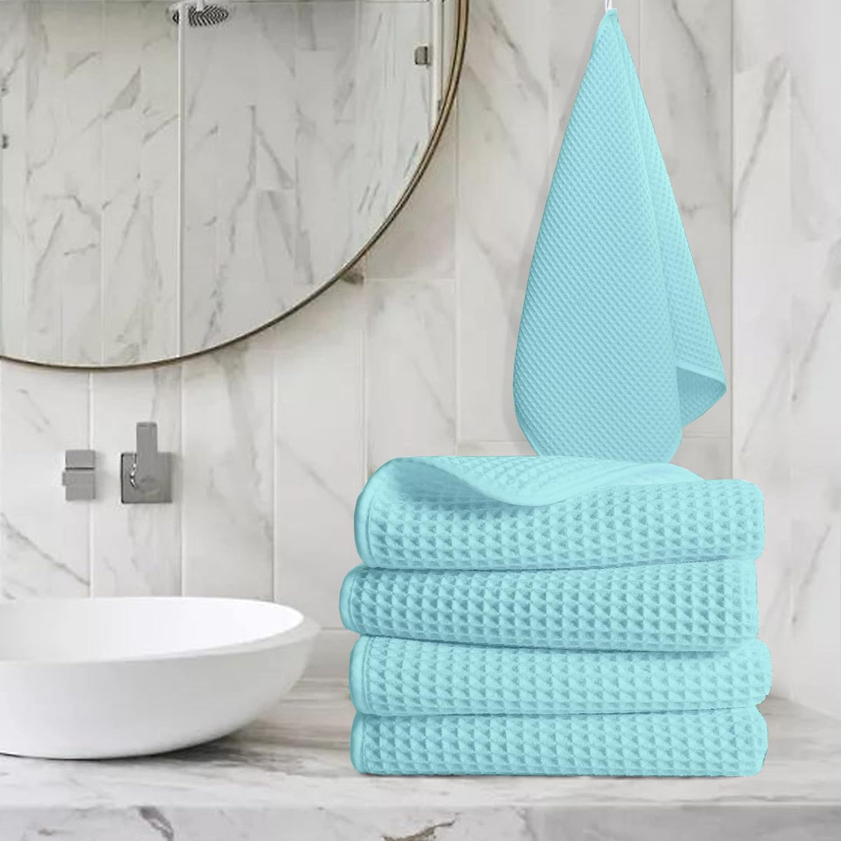 Pure cotton waffle hand towel in aqua on towel rail