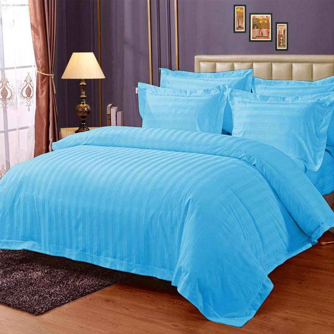 Pure cotton satin stripe king size bedsheet in sky blue on bed