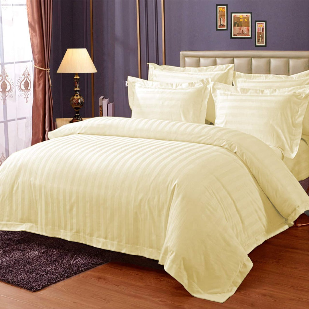 Pure cotton satin stripe bedsheet in light yellow on a double bed