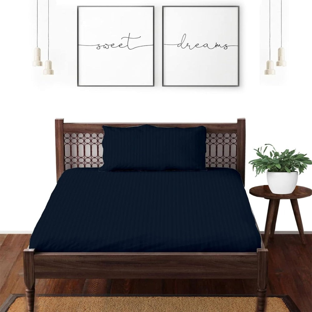 Satin striped pure cotton single bedsheet in navy blue on bed