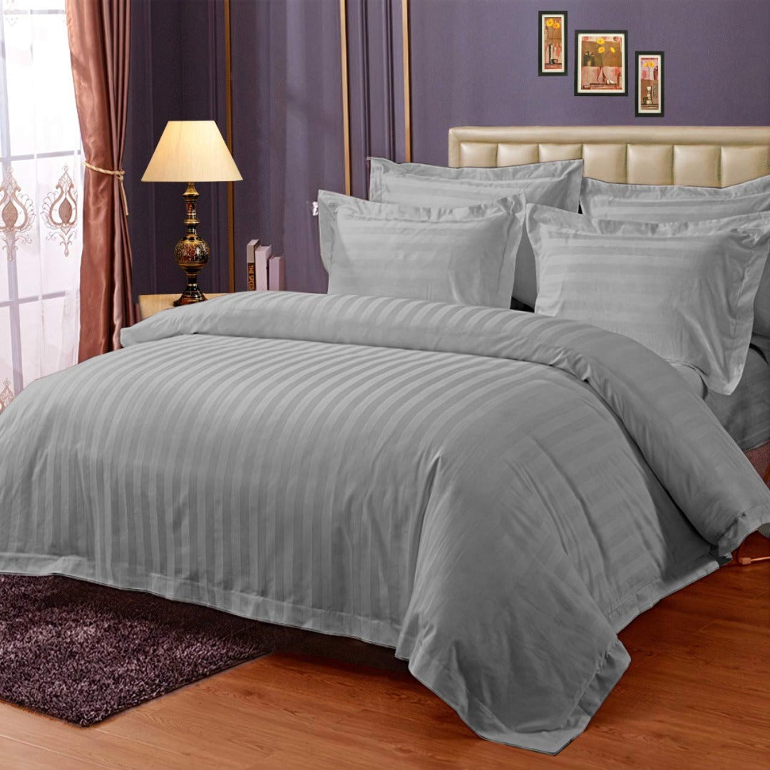 Pure cotton satin stripe king size bedsheet in silver on bed